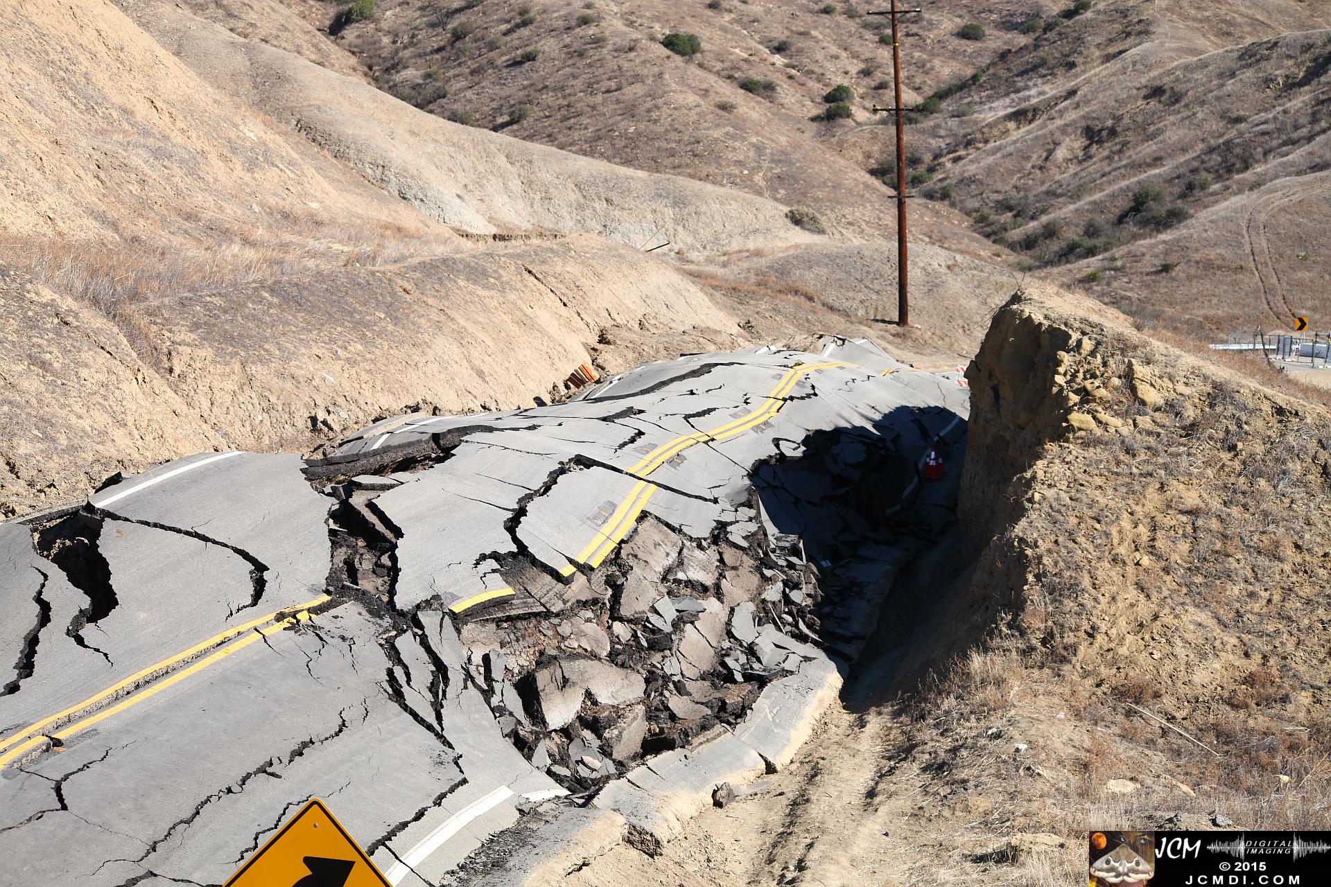 Landslide, buckled pavement, and terrain at Vasquez Canyon Road in Santa Clarita, CA filmed 11-25-2015